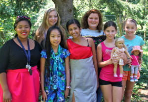 group of girls showing the projects they made at summer sewing camp