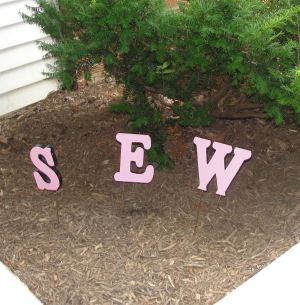 the word SEW in a garden