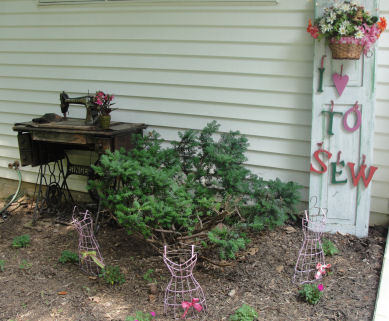 a pink garden with sewing things in it