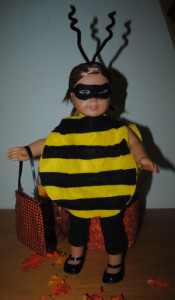 american girl doll in a handmade bumble bee halloween costume