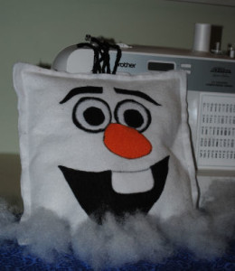 a square white felt olaf the happy snowman face pillow